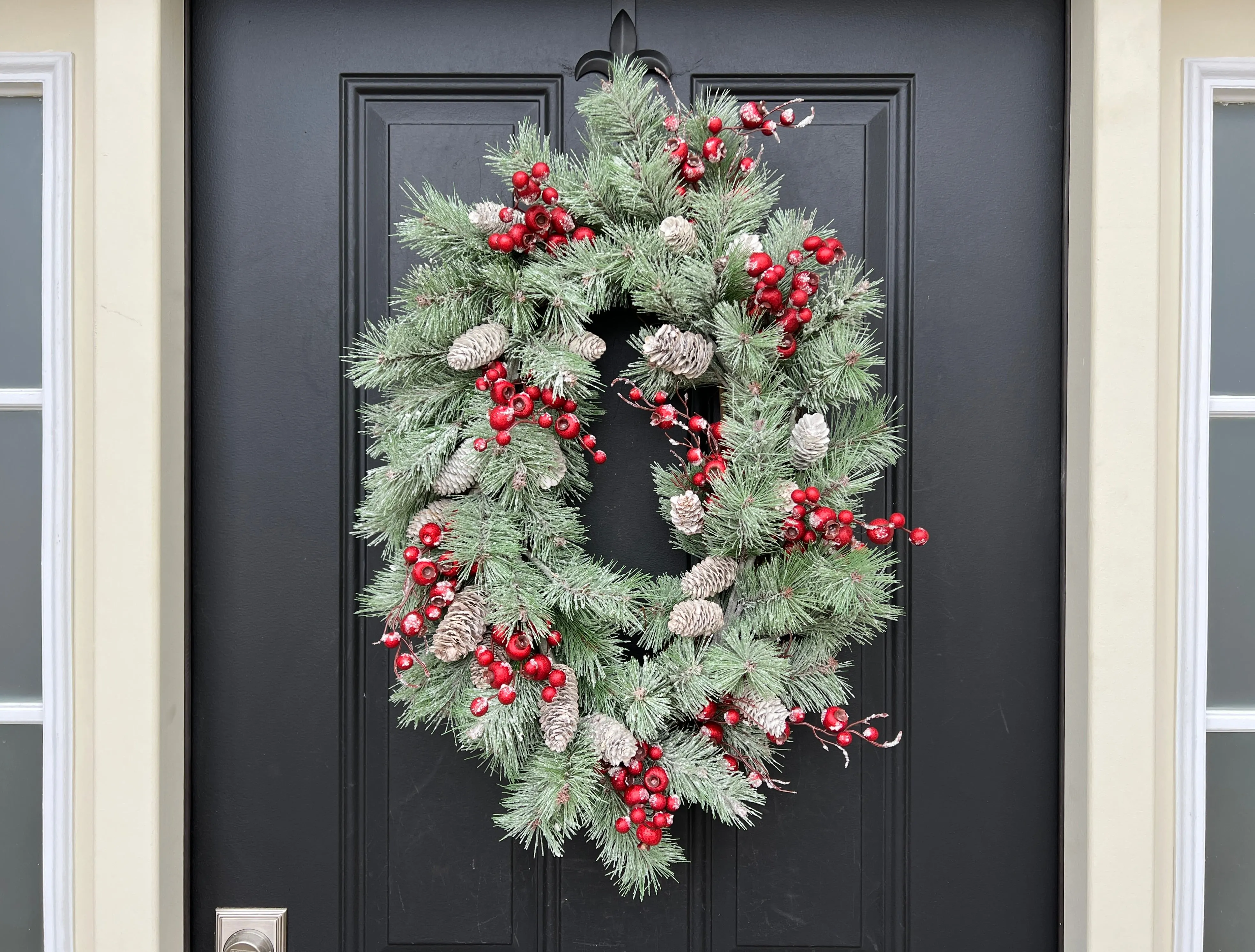 Oval Flocked Winter Pine Wreath with Red Berries and Pinecones